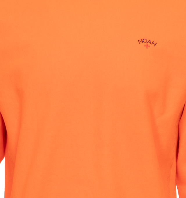 Image 3 of 3 - ORANGE - NOAH Core Logo Pocket T-shirt featuring embroidered logo on chest, crew neck, long sleeves and ribbed cuffs, hem and collar. 100% cotton.  