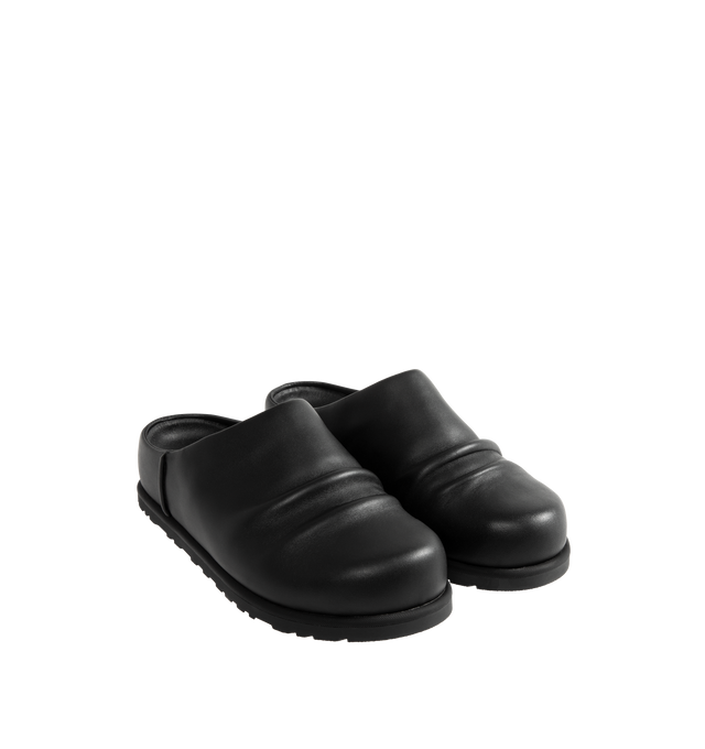 Image 2 of 4 - BLACK - UGG x Willy Chavarria Otzo Clog is crafted from premium black leather and features a slip-on silhouette for effortless everyday wear. Designed with custom Chavarria hardware logo and UGG's signature comfort-focused construction, the clog offers a refined take on casual footwear. Main Material: Leather. Unisex style in men's sizes.