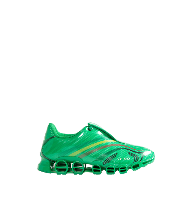 Image 1 of 5 - GREEN - Adidas x Mega Jah Jah Men's F50 TUNIT Mega Jah Jah Shoes feature a bold collaborative design that reimagines an iconic adidas silhouette through a rebellious, street-ready lens. Crafted with a sleek synthetic upper, this statement sneaker combines heritage adidas styling with premium comfort, featuring a soft leather lining and sockliner for an elevated feel. Finished with a durable rubber outsole for reliable traction, the design balances archival inspiration with contemporary attitu