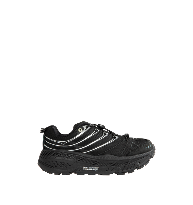 Image 1 of 5 - BLACK - HOKA Stinson EVO GTX Sneaker featuring ripstop upper, nubuck toe and heel overlays, waterproof GORE-TEX bootie construction, reflective webbing heel pull, speed-lace system and secondary lace option.