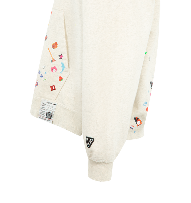 Image 3 of 3 - NEUTRAL - Maison Mihara Yasuhiro Kids Sticker Hoodie is crafted from cotton and features a relaxed silhouette with a drawstring hood, front kangaroo pocket, and signature Sticker graphic artwork for a playful contemporary look. This designer hoodie combines everyday comfort with Maison Mihara Yasuhiro's distinctive streetwear aesthetic, making it an easy layering piece for everyday wear. Main Material: 100% Cotton. Made in Japan.