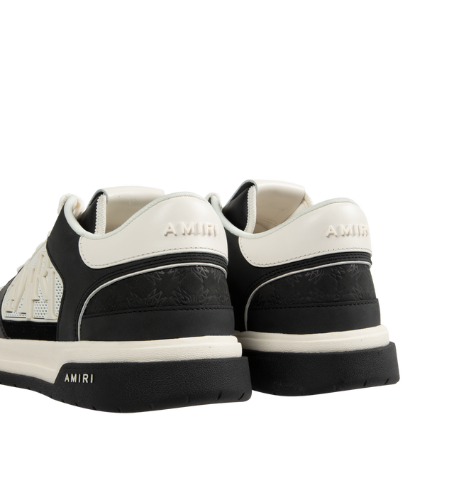 Image 3 of 5 - BLACK - Amiri Men's Classic Low Sneaker is a lace-up style crafted on a rubber sole with leather upper and central panels of molded rubber mesh framing the AMIRI staggered logo. Made in Vietnam. Upper: Leather. Sole: Rubber.