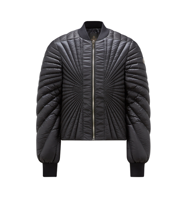 Image 1 of 1 - BLACK - MONCLER + RICK OWENS FW23 Radiance Flight Jacket in airy, lightweight duvet fabric with below waist length. Featuring a visible central zipper, side pockets with snap closure, internal zippered pockets, ribbed collar and cuffs, an exclusive Rick Owens Radiance stitching design all over, cotton webbing strap with rivet detail accross the back yoke and a small Moncler + Rick Owens logo on the left sleeve. LINING: 100% Polyester PADDING: 90% Down, 10% Feather DETAILS PADDING: 100% Polyes 