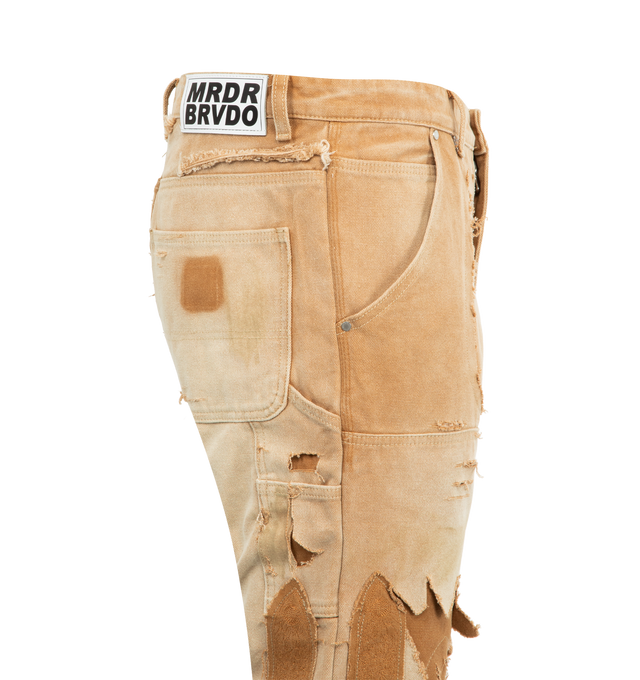 Image 3 of 3 - BROWN - WHO DECIDES WAR Unearthed Distressed Trousers featuring a mid-rise, straight-leg silhouette, extreme distressing, signature cathedral-inspired patches, five-pocket style, zip fly and button closure. 100% cotton.