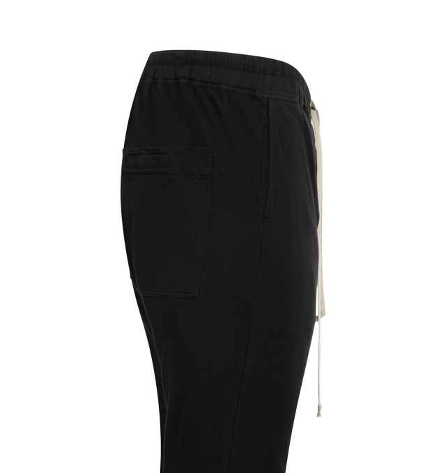 Image 3 of 3 - BLACK - DRKSHDW Berlin Drawstring Pant featuring elastic drawstring waistband and button fly, signature extended logo tag, front and back pockets and jersey fabric with side hem slits. 100% organic cotton.