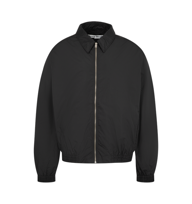 Image 1 of 3 - BLACK - Acne Studios Mens Nylon Jacket is crafted from lightweight recycled nylon with a semi-shiny finish. Features a regular fit, below-waist silhouette, pointed collar, front zip closure, side-seam pockets, elasticized cuffs and hem, full lining, and Acne Studios 1996 logo at the back. Main Material: 100% Nylon; Lining: 55% Polyester, 45% Viscose. Made with recycled nylon and recycled polyester/FSC-certified viscose lining. Made in Portugal.