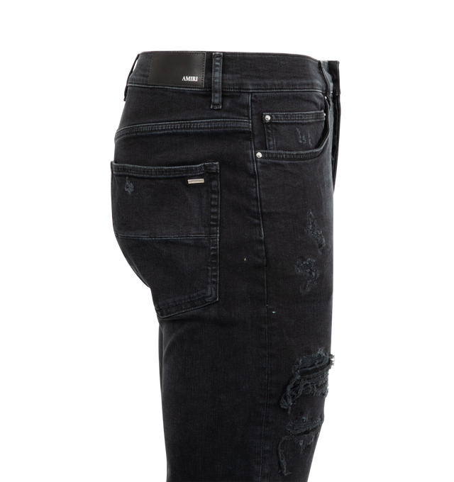 Image 4 of 4 - BLACK - AMIRI Nean Lights Slim Jeans featuring belt loops, five-pocket styling, button fly, logo appliqu at outseam, logo patch at back waistband and flared hem. 98% cotton, 2% elastane. Made in United States.
