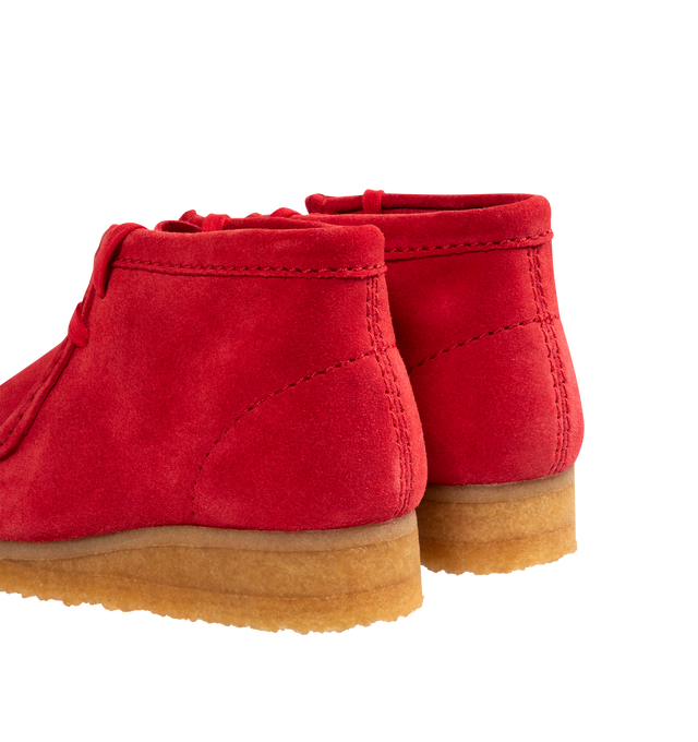 Image 3 of 4 - RED - CLARKS Wallabee Boot featuring a rich red suede upper with hand-stitched apron seams, classic moccasin construction, two exclusive FOBs, amber pebble crepe sole, woven sock label and red tassels.