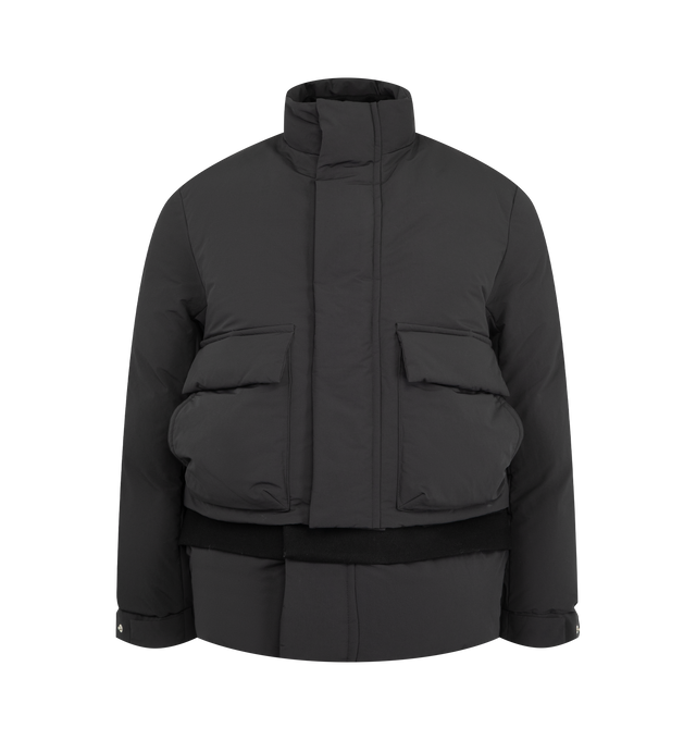 Image 1 of 5 - BLACK - Sacai Men's Double Padded Jacket with Zip Closure is crafted from polyester and features an oversized hybrid silhouette that combines elements of a jacket and coat. Designed with a concealed zip closure beneath a buttoned placket, a layered lower section with button fastening, front patch pockets, and ribbed elasticated cuffs for a functional yet refined finish. Main Material: 100% Polyester.