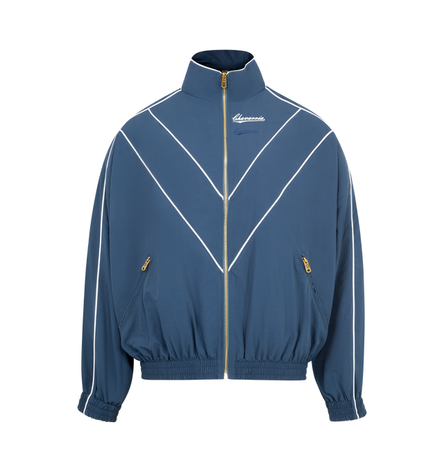 Image 1 of 3 - BLUE - WILLY CHAVARRIA Bad Boy Track Jacket featuring front zipper closure, side slant pockets with zipper closer, logo detail on left side of chest and elastic at waist. 100% nylon. Made in USA.