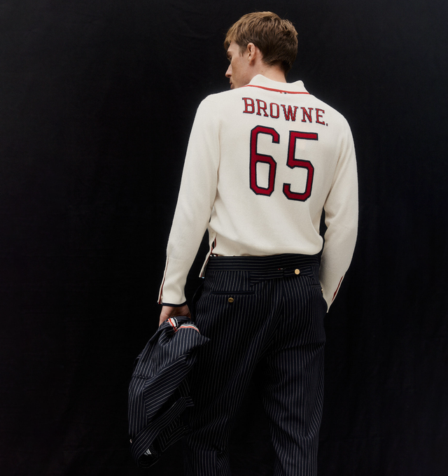 Image 3 of 5 - WHITE - THOM BROWNE Browne. 65 Jersey Polo featuring a sporty polo collar, Browne lettering and the number 65 on back, partial front button closure, buttoned side vents with signature striped grosgrain trim, buttoned cuffs with signature striped grosgrain trim and signature striped grosgrain loop tab. 100% cashmere. Made in Italy.