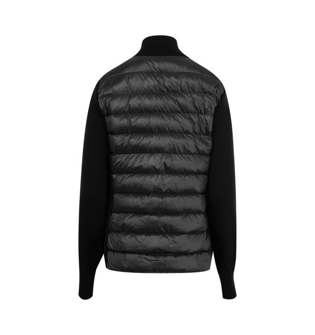 Image 2 of 3 - BLACK - MONCLER Padded Wool Zip-Up Cardigan featuring an attached drawstring hood, front zip closure, channel-quilted body, ribbed cuffs and hem, zip pockets, flap sleeve pocket, and logo patch detail. Lined body and hood. 100% polyamide/nylon. Padding: 90% down, 10% feather.