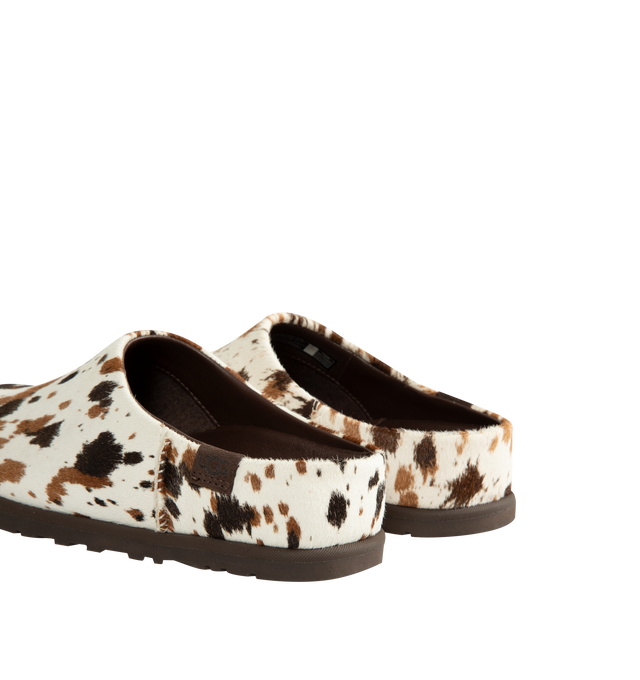 Image 3 of 4 - BROWN - Ugg Women's Otzo Western Clog is crafted with a hand-painted cow hair upper and reimagines the brands signature clog silhouette through a Western-inspired lens. Designed for all-day comfort, this distinctive style features a leather and RWS wool jersey lining enhanced with a peppermint-based anti-odor treatment, along with a contoured EVA footbed for cushioning and support. A leather and microfiber sockliner provides additional comfort, while the lightweight rubber outsole with 30% FC