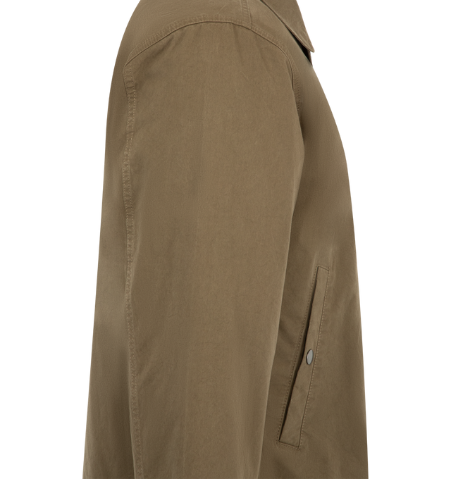 Image 3 of 4 - BROWN - The Row Rafi Jacket is crafted from classic English cotton Mackintosh fabric and features a clean, straight silhouette with wrist-length sleeves. Developed without a waxed finish, the fabric is fully waterproof, including along the seams, offering functional weather protection while maintaining The Row's refined, minimalist aesthetic. Finished with a polyamide and cotton lining for added structure and comfort. Main Material: 100% Cotton. Lining: 100% Polyamide, 100% Cotton. Fit: Strai