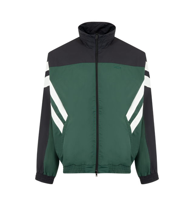 Image 1 of 3 - GREEN - VETEMENTS Track Jacket featuring technical jersey, colour-block design, front two-way zip fastening, mock neck, drop shoulder, long sleeves, stripe detailing, embroidered logo at the chest, two side welt pockets, embroidered logo to the rear and elasticated hem. 100% polyester.