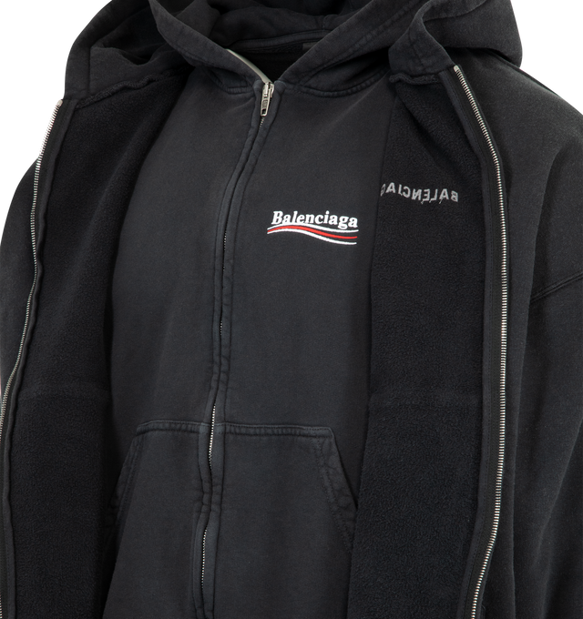 Image 3 of 3 - BLACK - BALENCIAGA Layered Zip-Up Hoodie featuring dry fleece, layered construction: 2 hoodies, hood without drawstring, dropped shoulders, zipped front, double-ended zip fastening, 2 pockets at front, gathered at cuffs and waistline, Balenciaga Back artwork embroidered at front and back on the first hoodie and Political Campaign artwork embroidered at chest on the second one. 100% cotton. Made in Portugal.