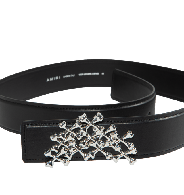 Image 2 of 2 - BLACK - AMIRI 4cm Bones Belt featuring pushpin closure and silver-tone bones detail at buckle. 100% genuine leather. Made in Italy. 