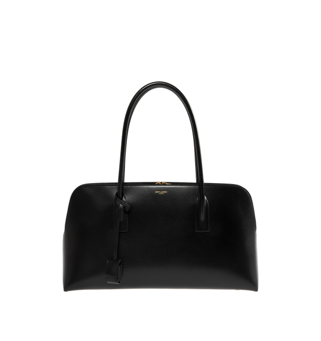 Image 1 of 3 - BLACK - SAINT LAURENT Sac de Jour Large Bowling Top-Handle Bag featuring rolled top handles with keyring and padlock tag, open top, center zip compartment divides interior, one slip pocket with snap closure, feet protect bottom of bag and light bronze hardware. 8.6"H x 16.1"W x 1.1"D. Leather. Made in Italy.
