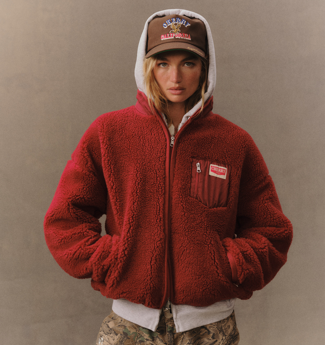 Image 4 of 6 - RED - Cherry LA Zip Up Sherpa Jacket is crafted from custom sherpa fleece and features a boxy-fit silhouette, a full-zip front closure, and zippered pockets for secure storage. Designed with elastic binding at the openings and signature chevron labels at the pockets, this cozy layer combines everyday comfort with clean utilitarian detailing. Main Material: Custom Sherpa Fleece
