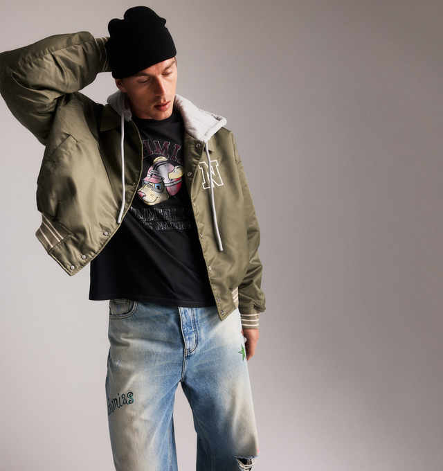 Image 3 of 5 - BLUE - NAHMIAS Bandaid Baggy Jeans featuring five pocket styling, baggy fit, embroidery throughout, distressing and hole in the knee. 100% cotton.