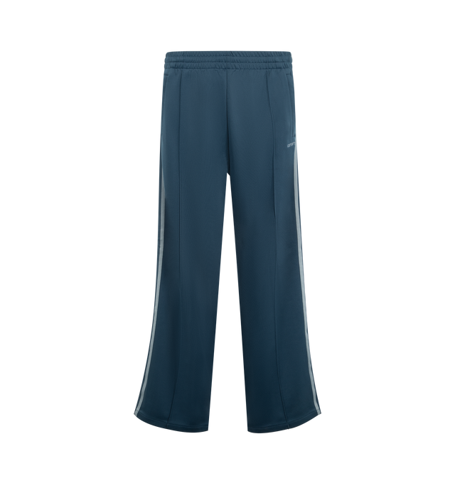 Image 1 of 3 - BLUE - CARHARTT WIP Bolar Sweat Pant featuring a loose fit, midweight, unbrushed polycotton jersey, knitted tape detailing on each leg, zipped pockets on the front and back and an embroidered Script Logo. 64% polyester, 36% cotton.