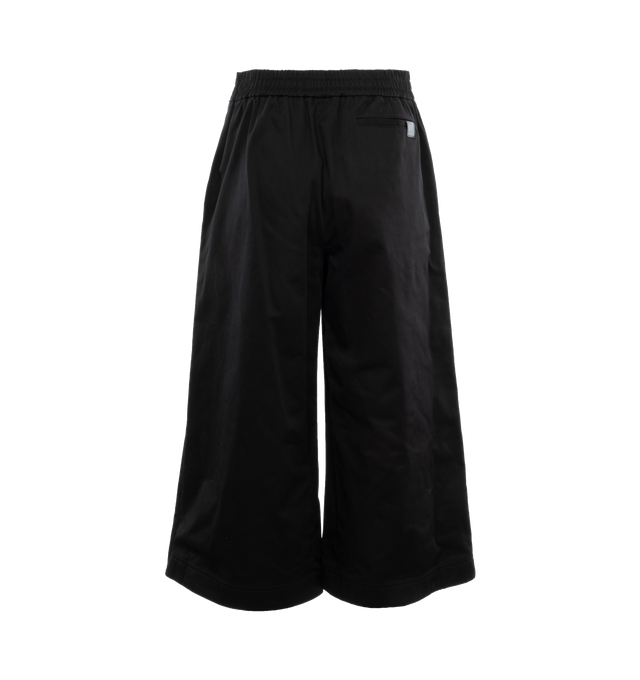 Image 2 of 5 - BLACK - Loewe Trousers crafted in lightweight cotton with a folded panel at the front. Featuring a relaxed fit, cropped length, mid waist, loose leg, partly elasticated waistband, side zip fastening, seam pockets, rear welt pocket with Anagram embossed leather tab placed on the rear pocket. Made in Italy. 