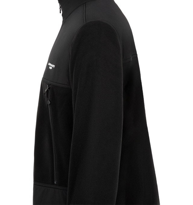 Image 3 of 3 - BLACK - Carhartt WIP Men's Edmore Jacket is crafted from polyester fleece and features a balloon fit with dropped shoulders, a mesh-lined interior, and a front zip closure. Designed with a zip chest pocket, adjustable hem, elasticated cuffs, and embroidered logo detailing at the chest, this relaxed silhouette combines warmth and everyday functionality. Main Material: 100% Polyester Fleece.