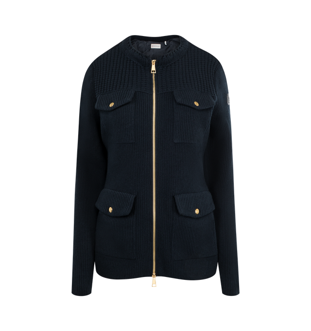 Image 1 of 2 - NAVY - MONCLER Wool Zip Cardigan featuring gold-tone hardware, round neckline, long sleeves, flap pockets, tailored fit and two-way zip-front. Virgin wool, polyester. Lining: polyester.