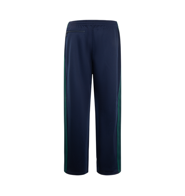 Image 2 of 3 - BLUE - Needles x Fila Men's Ventisei Track Pant is crafted from polyester and features a relaxed track pant silhouette inspired by FILA's sportswear heritage. Designed as part of the first collaboration between Needles and FILA, it is finished with bold color-block detailing, signature branding accents, and an elasticized waistband for everyday comfort. Main Material: 100% Polyester.