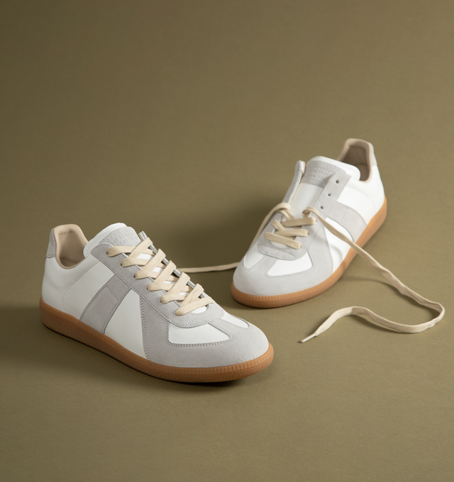 Image 6 of 6 - WHITE - Maison Margiela Replica Sneakers featuring lace-up sneakers in buffed nappa calfskin and calfskin suede, contrasting sole, Maison Margiela logo label on the tab, internal Replica label, internal elastic and all-over Maison Margiela logo insole. 100% calf leather. Sole: 100% rubber. Made in Italy.