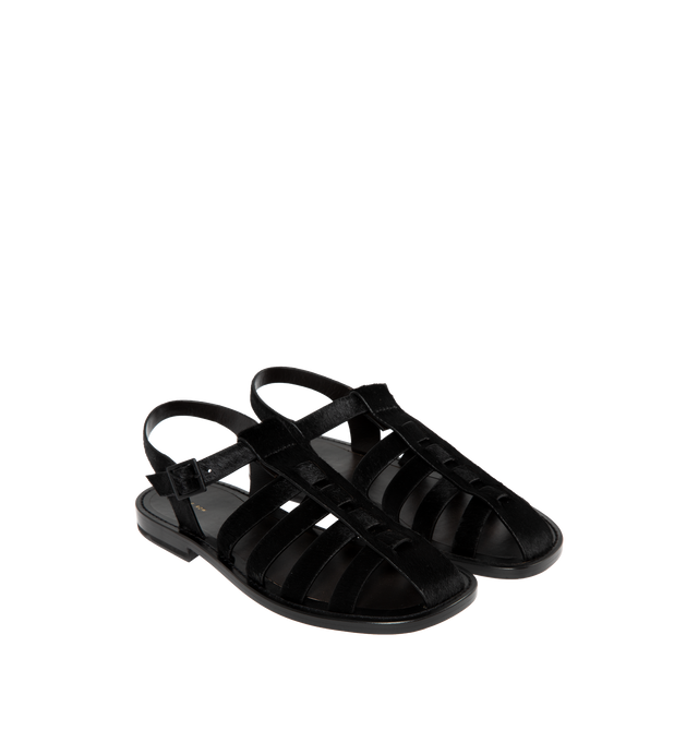 Image 2 of 4 - BLACK - THE ROW Pablo Sandal in Pony featuring artisanally-crafted fisherman sandal in smooth pony hair leather with woven leather straps, closed rounded toe, tinted buckle closure, and flexible leather sole. 100% leather. Made in Italy. 