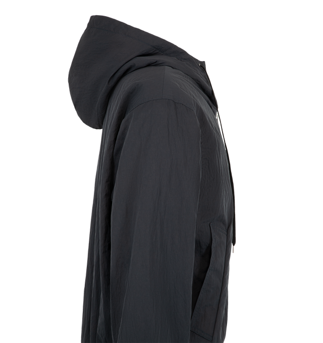 Image 3 of 3 - BLACK - Studio Nicholson Men's Wickett Jacket is crafted from Italian-milled water-repellent technical fabric and features a relaxed silhouette with a drawcord hood and soft rib-knit trims. Designed as an elevated interpretation of a classic sportswear staple, this versatile jacket is lined in a warm wool blend for added comfort and insulation while maintaining a clean, understated appearance. Main Material: 100% Polyamide. Lining: 70% Wool, 30% Polyamide.