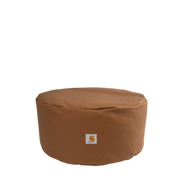 Image 1 of 2 - BROWN - CARHARTT WIP Canvas Pouf featuring cotton Dearborn Canvas with a waxed finish. Inside, the item is filled with recycled EPS beads. A carry handle appears at the back and a woven Square Label on the front completed the design. 19.7 x 9 inch. 100% cotton (Dearborn Canvas).