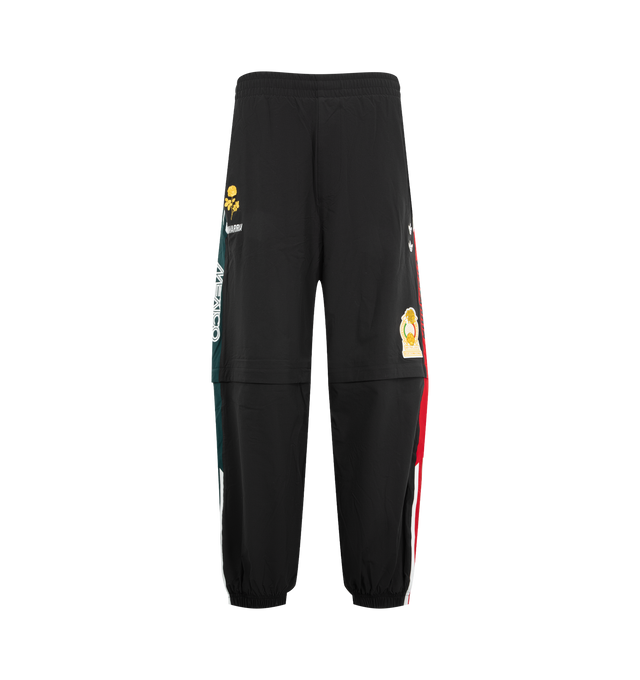 Image 1 of 4 - BLACK - Adidas Mens Convertible Woven Pants feature a woven construction with zip-off lower legs for convertible wear. Designed with an elastic waistband, zip closures at the knees, applied 3-Stripes along the upper and lower legs, embroidered logos and artwork, and side pockets. Made in Indonesia.
