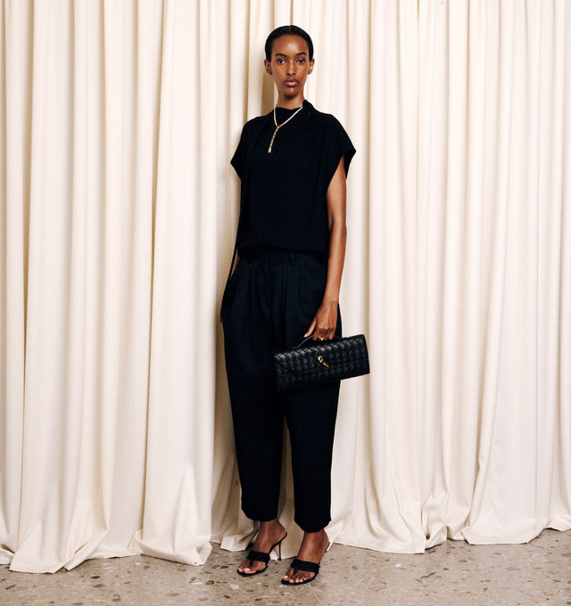 Image 3 of 3 - BLACK - Isabel Marant Womens Selene-GB Top is crafted from a textured acetate blend. Features a relaxed silhouette with a stand collar, self-tie neck bow, concealed button-front closure, cap sleeves, and a curved hem. Main Material: 60% Acetate, 40% Polyester. Made in Romania.