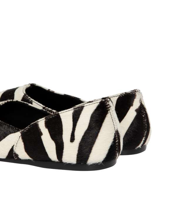 Image 4 of 5 - BLACK - KHAITE Jane Flat in Zebra Haircalf featuring a slipper-like flat, a flexible, cushioned insole for cloud-like comfort and signature gold staple detail at rounded vamp. Zebra print haircalf - 100% calfskin. Made in Italy.