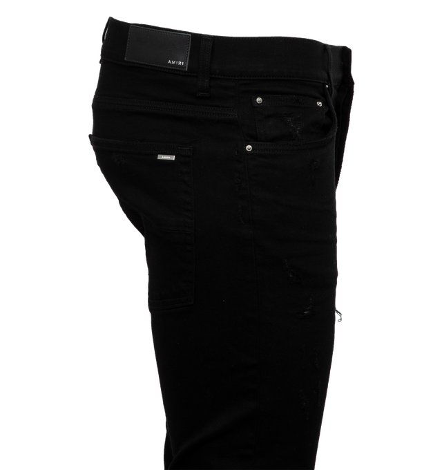 Image 2 of 3 - BLACK - AMIRI Mx1 Suede Jean featuring button fly, 5-pocket design, intentionally destroyed areas, light whiskering and fading detail. 92% cotton, 6% elastomultiester, 2% elastane. Made in USA. 