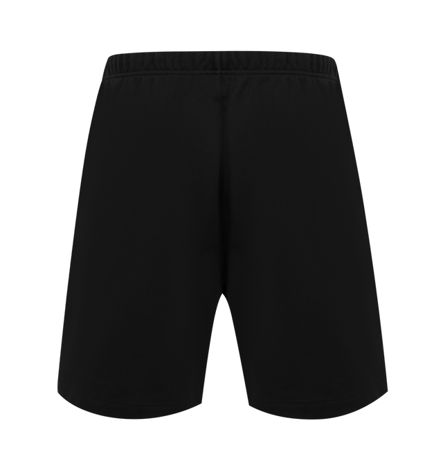 Image 2 of 3 - BLACK - FEAR OF GOD ESSENTIALS Soccer Fleece Shorts featuring cotton-blend fleece shorts, drawstring at elasticized waistband, two-pocket styling, rubber logo patch at front and bonded logo at leg. 80% cotton, 20% polyester.