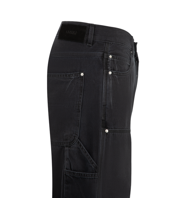 Image 3 of 4 - BLACK - Amiri Mens Lightweight Cotton Carpenter Jeans are crafted from cotton denim with lived-in washed and riveted front patches. Features a classic five-pocket construction, front patch panels, carpenter hammer loop, and zip-fly with button closure. Main Material: 100% Cotton. Made in Italy.