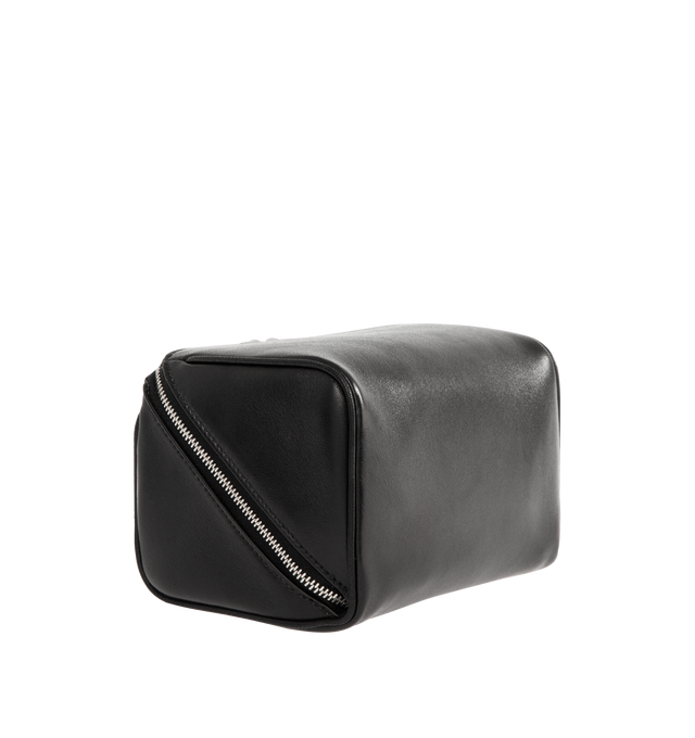 Image 2 of 3 - BLACK - SAINT LAURENT Small Cube Trousse Leather Toiletry Case featuring a top handle decorated with the embossed logo signature, zip-around closure, wide opening, one interior zip pocket and nylon lining. 3.9"H x 6.2"W x 3.93"D. Made in Italy.