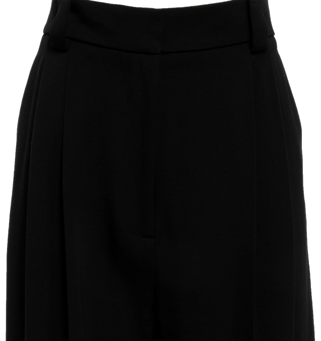 Image 4 of 4 - BLACK - KHAITE Simone Pant featuring mid-rise, reverse pleats, relaxed leg, wider waistband, inset side pockets, and welt pockets. 77% virgin wool, 23% viscose. 