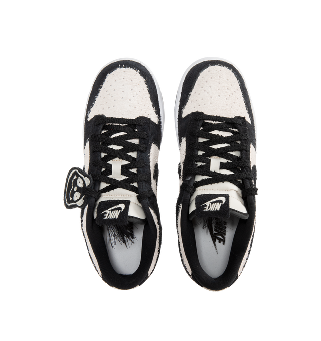 Image 5 of 5 - WHITE - NIKE Dunk Low Retro SE Sneaker featuring iconic Panda colorblocking in a hairy suede iteration, paired with plush padding, foam midsole offers lightweight, responsive cushioning, rubber outsole with classic pivot circle, low-cut collar and hairy Panda tag.