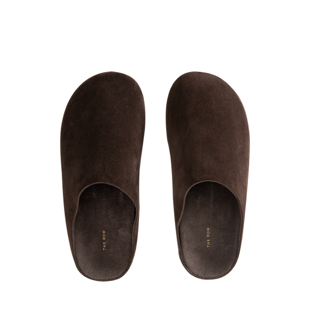 Image 4 of 4 - BROWN - THE ROW Hudson Slide in Suede featuring relaxed slip-on shoe in natural suede with round toe, contoured footbed, and rubber sole. 100% calfskin leather. Rubber sole. Made in Italy.