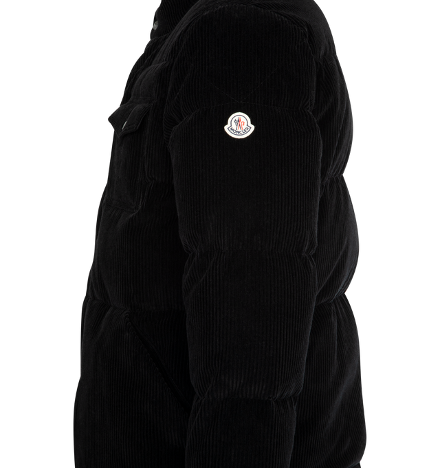 Image 4 of 4 - BLACK - MONCLER Serrant Corduroy Short Down Jacket featuring polyester lining, down-filled, zipper and snap button closure, zipped pockets, chest pocket with zipper and snap button closure, adjustable cuffs and hem with elastic drawstring fastening. 100% cotton. Padding: 90% down, 10% feather. Made in Romania.