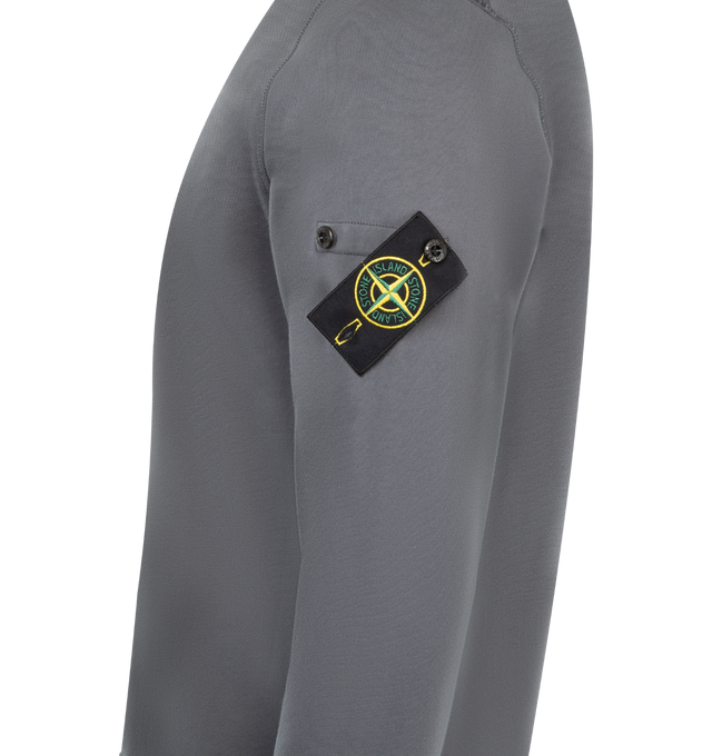 Image 3 of 3 - GREY - STONE ISLAND Crewneck Sweatshirt featuring ribbed neckline, lunette under back neckline with internal reinforcement, raglan sleeves on back, Stone Island badge on left sleeve, ribbed cuffs and bottom band, overlock stitching at seams and regular fit. 100% cotton.