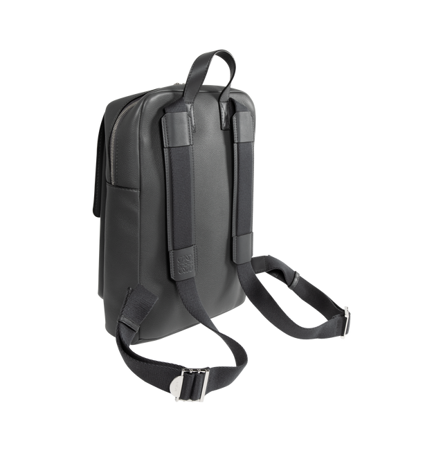 Image 2 of 3 - GREY - LOEWE Military Backpack featuring one main compartment, an additional section under a fold over flap that closes with a magnetic fastening, back, shoulder or top handle carry, large internal pocket to accommodate a laptop, herringbone cotton canvas lining and embossed Anagram. 15.4 x 11.2 x 4.3 inches. 100% soft grained calfskin. Made in Spain.