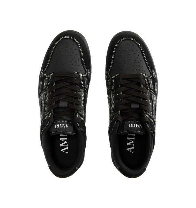 Image 5 of 5 - BLACK - AMIRI Skel Top Low Sneaker featuring low-top sneaker crafted with hand-cut skeletal appliqus along the sidewalls, perforated toe, padded collar, molded insole and lace-up style. Leather upper, textile lining, rubber sole.