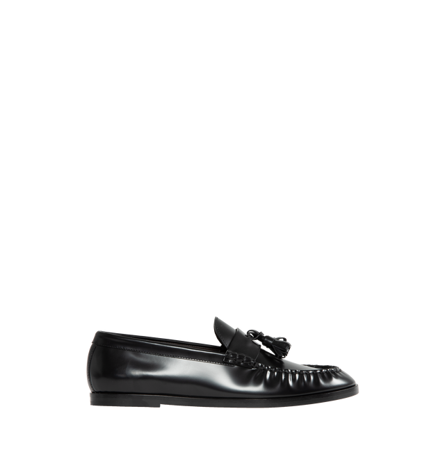 Image 1 of 4 - BLACK - THE ROW Loafer featuring sleek calfskin leather with natural pleating effect and tassel detailing. 100% leather. Made in Italy. 