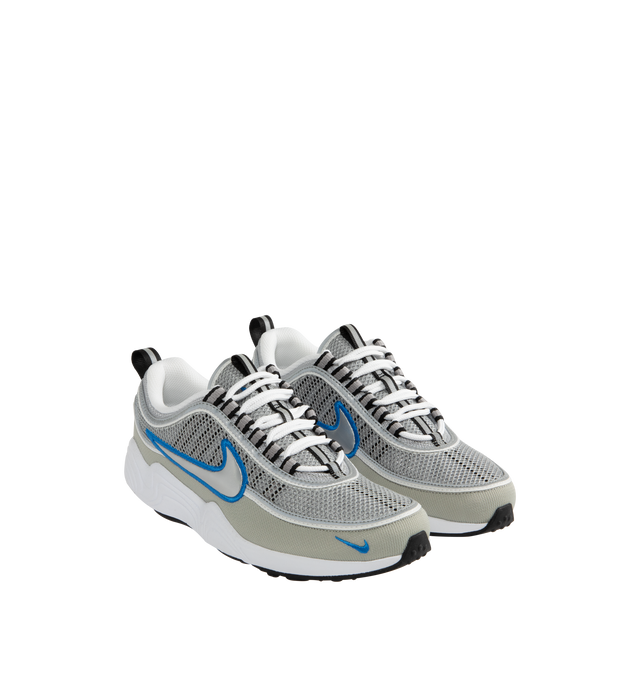 Image 2 of 5 - SILVER - Nike Air Zoom Spiridon SP Sneakers are a lace-up style with reflective piping, mesh uppers, Zoom Air cushioning, metallic overlays, signature branding details, contoured footbeds, and rubber outsoles.