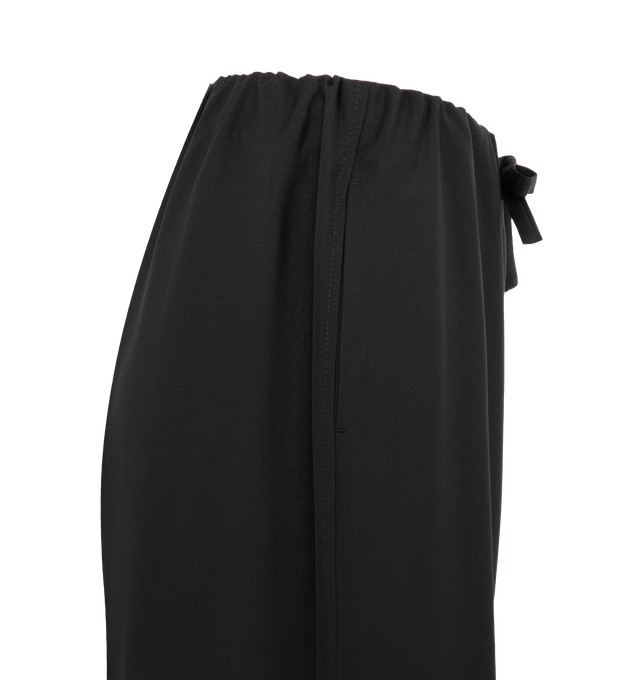 Image 3 of 3 - BLACK - TOTEME Drawstring Dinner Trousers featuring wide leg, tailored from fluid wool, an elasticated drawstring waistband that folds inward to create voluminous gathers and side pockets. 100% wool.